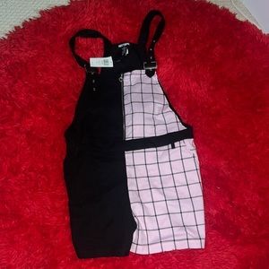 Half black and half plaid pink romper. Never warn, new with tags